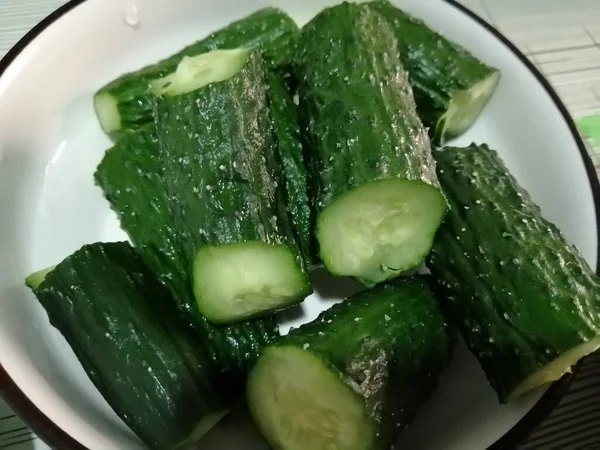 fresh green cucumber with water drops
