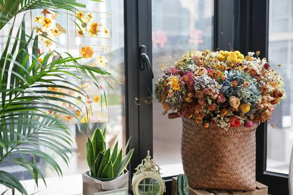 beautiful flowers in pots on window sill