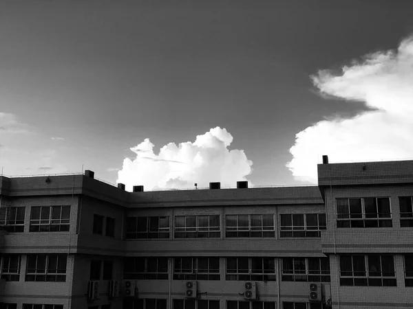 black and white photo of a modern building