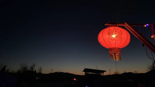 red hot air balloon in the night sky