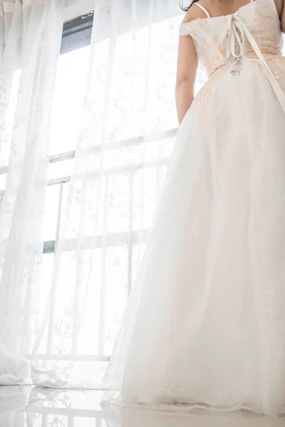 bride in white dress with wedding veil