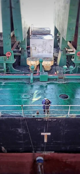 industrial factory, technology and people concept-close up of a man with a machine