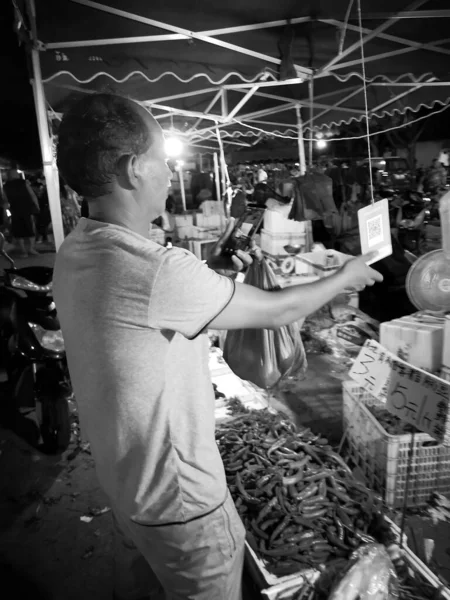 young man and woman in the market
