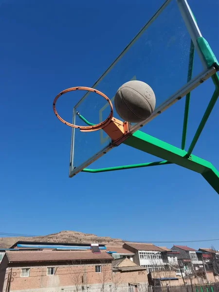 basketball hoop on the roof of a stadium