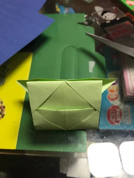 a lot of origami envelopes with a bow on a blue background