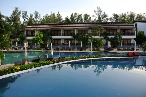 swimming pool with green grass and blue sky