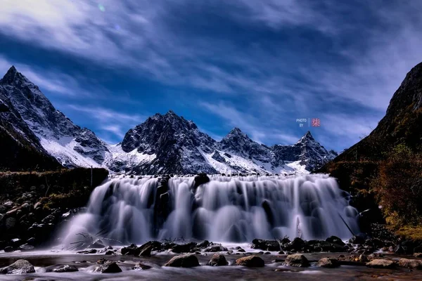 beautiful landscape with a waterfall in the mountains