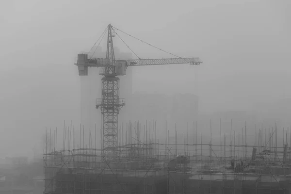 construction cranes and building on the background of the city