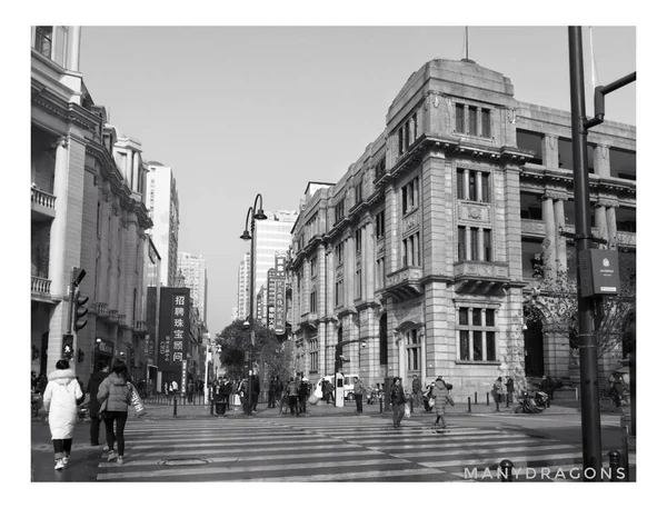 black and white photo of a street in the city