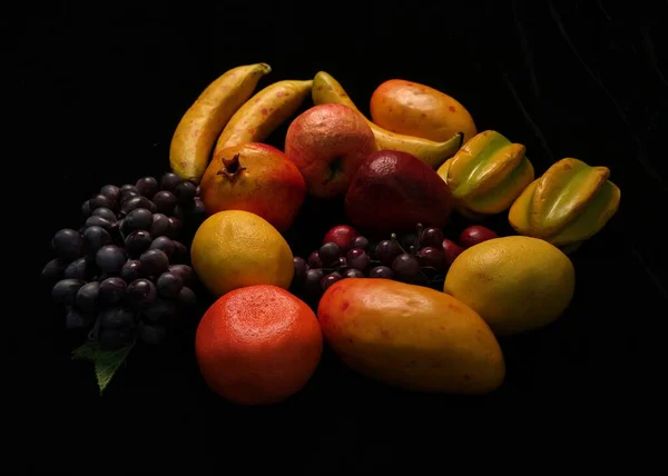 fruits and vegetables on a black background