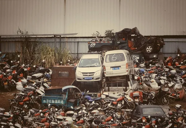 scrap, germany-march, 2019: many cars in the parking lot of a pile of garbage