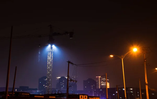 construction site with cranes and building