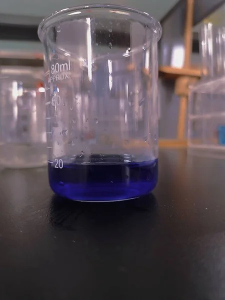 laboratory glassware with liquid and chemical liquids