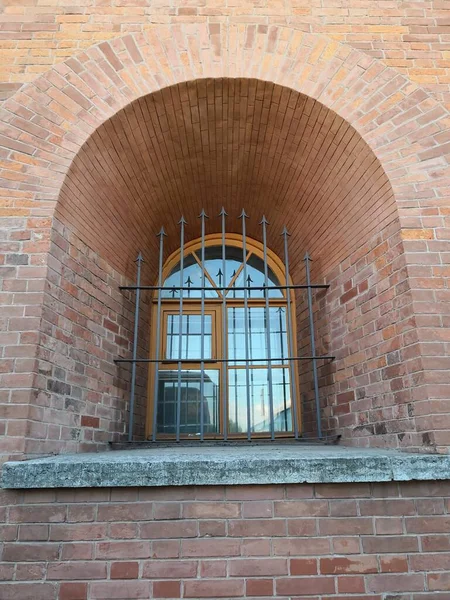 old brick wall with a window