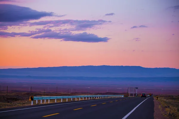 sunset over the highway in the desert