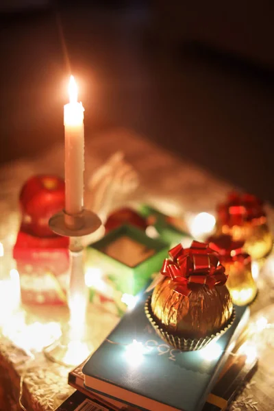 christmas composition with candles and candle on table