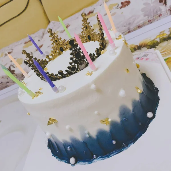a closeup shot of a beautiful decorated birthday cake with a white background
