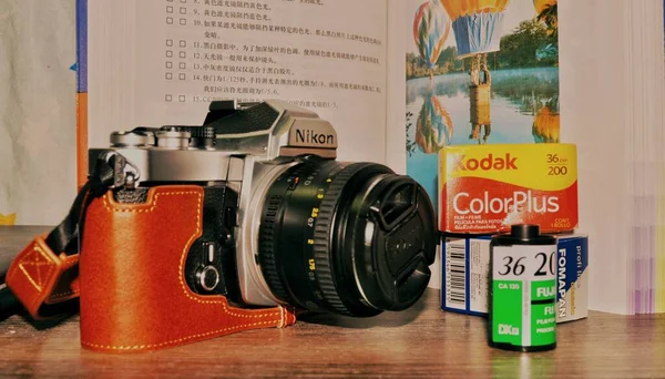 old camera with a vintage film and a book