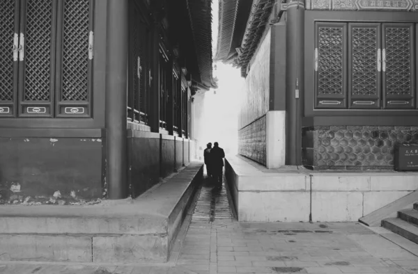 black and white photo of a young couple in the city