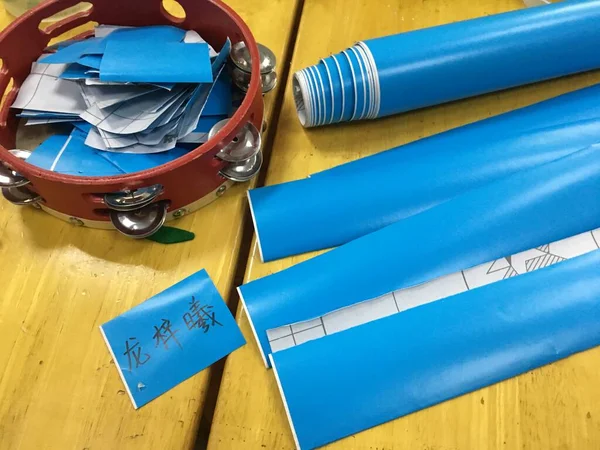 close-up of a pile of paper with a blue background