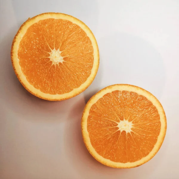 orange slices of fresh ripe oranges on a white background