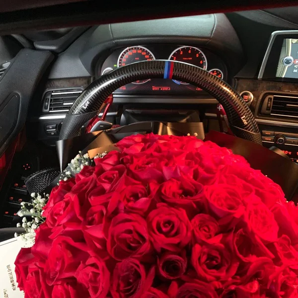 red roses in the car