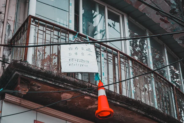 street sign, old building with a window