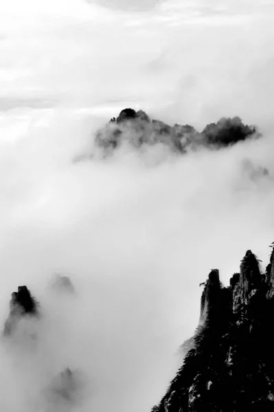 black and white clouds in the mountains