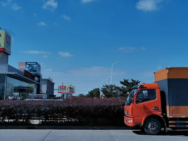 modern city with cargo truck and blue sky