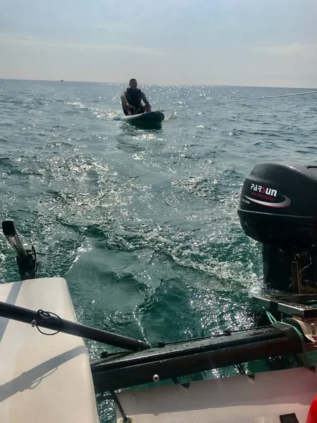 man in boat with a fishing rod