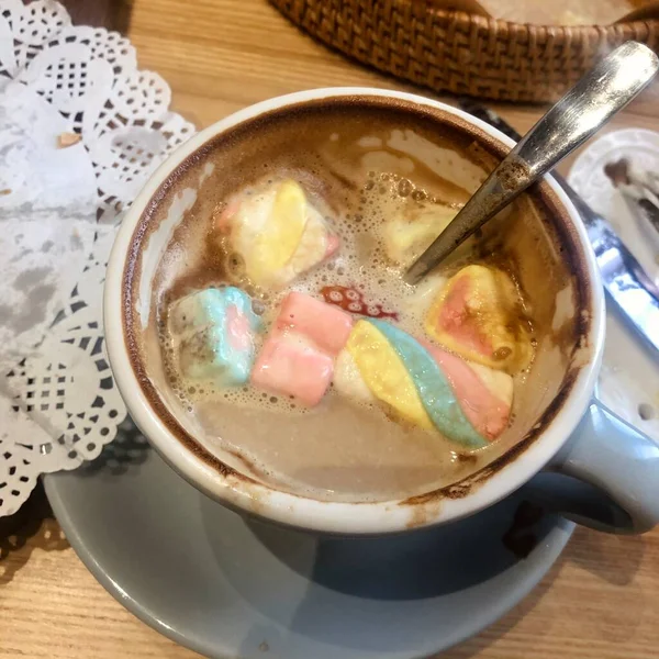 soup with a cup of coffee and a spoon on a wooden background