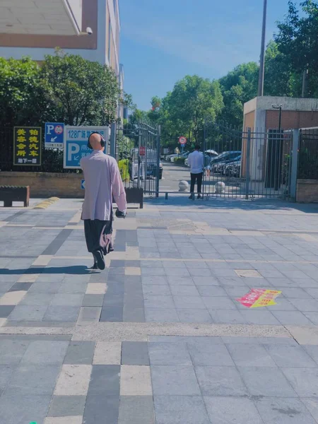 man in a suit walking in the city