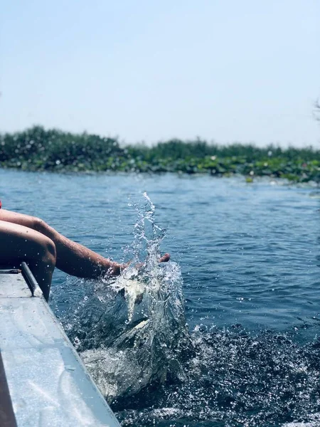 young woman in water with a mask on the lake