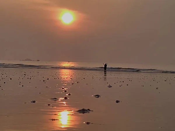 silhouette of a man on the beach