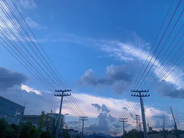 high voltage power lines and blue sky