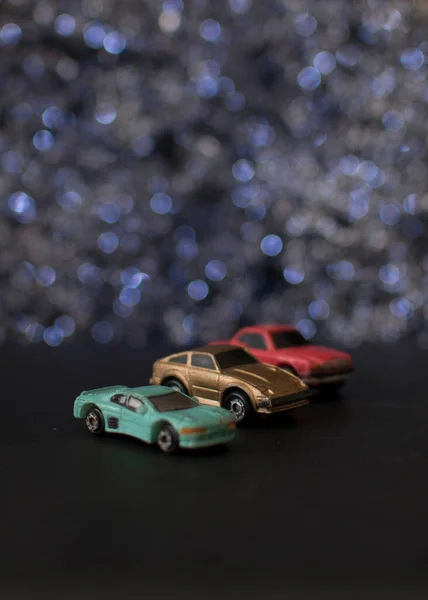 toy car with a lot of small cars on a wooden background