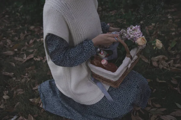woman with a bouquet of flowers in a basket