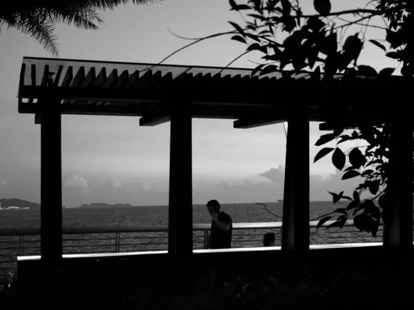 silhouette of a man and woman on the beach