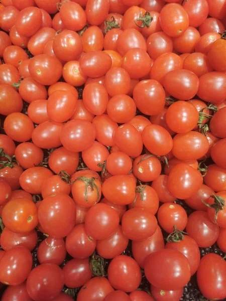 fresh red tomatoes on a market