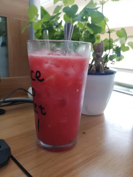 red juice with strawberry and mint