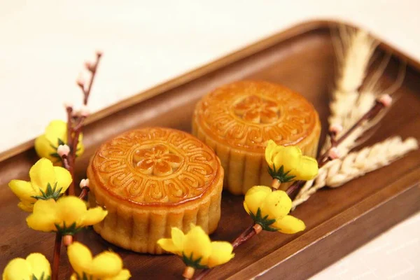 mid autumn festival moon cake with yellow and white background