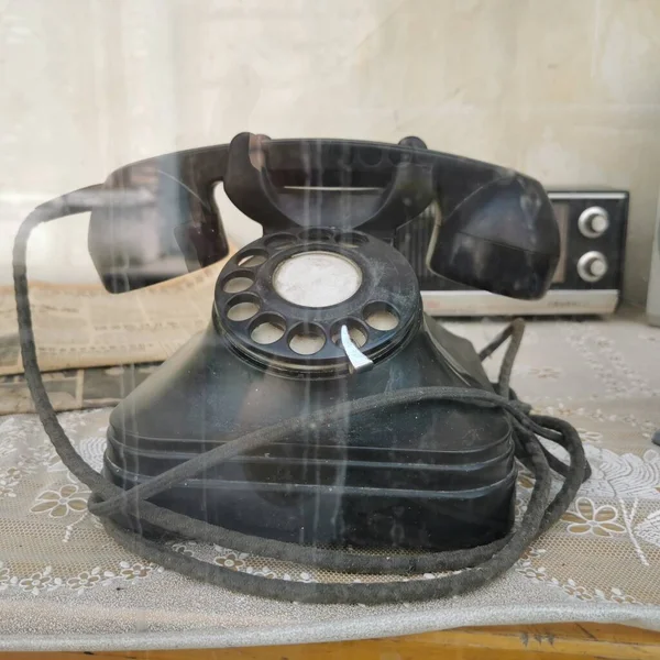 old telephone on a wooden table