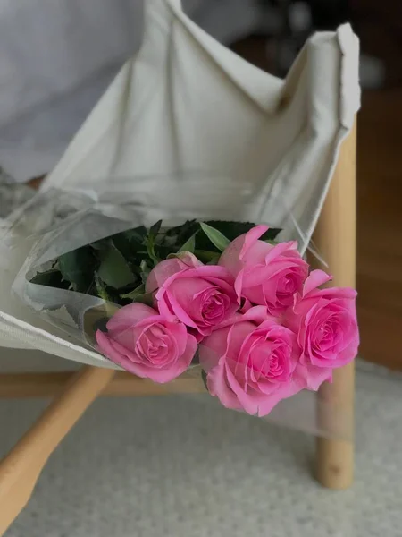 beautiful bouquet of roses in a vase on a white background