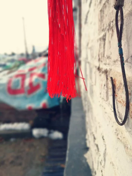 red rope hanging on the wall