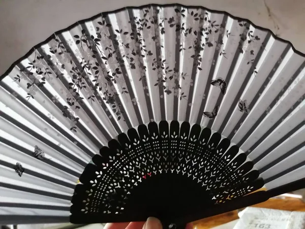 close up of a fan of a beautiful white and black color