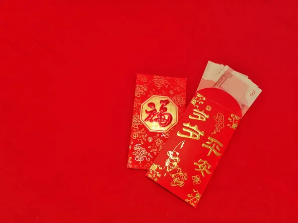 chinese new year red packet paper envelope with a blank card on a white background