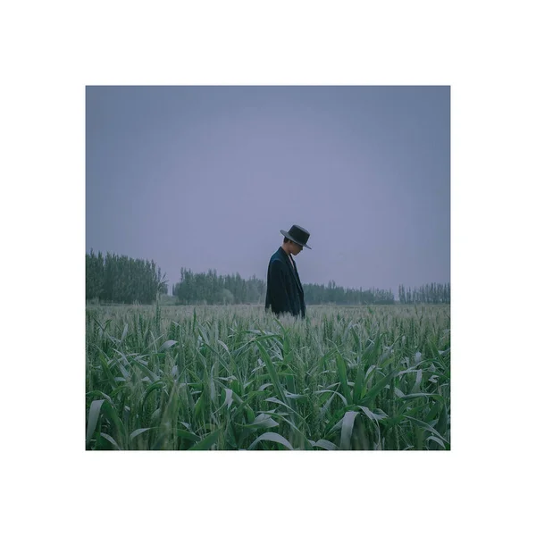 man with a bag of rice in the field