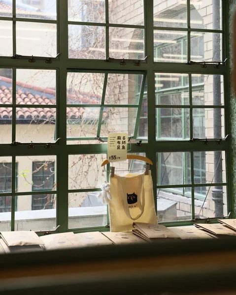 glass window with a cup of coffee and a mug of tea