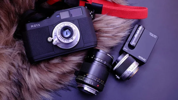 camera and photo of a vintage film slr cameras on a black background.