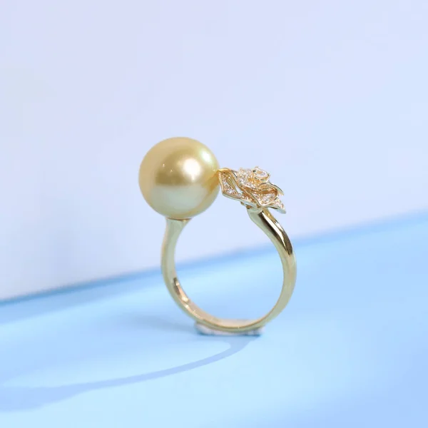 gold ring with diamonds on a white background